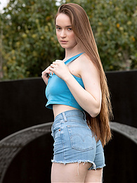 AdsPics presents: Beautiful Brunette Teen Hazel Shows Off Her Hairy Pussy and Masturbates Outdoors.